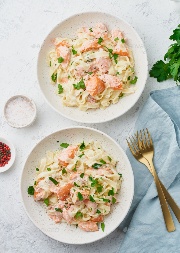 Salmon pasta, tagliatelle with fish and creamy sauce. Italian dinner